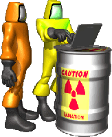 Two people in hazmat suits. One is looking at a laptop that is resting on a radioactive barrel